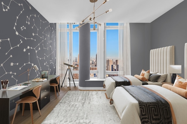 bedroom featuring hardwood / wood-style flooring and floor to ceiling windows