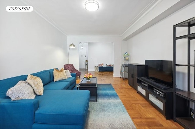 living room with parquet flooring and ornamental molding