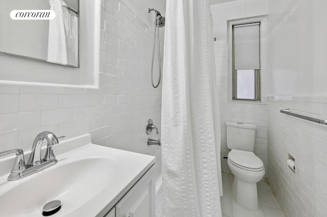 bathroom with a shower with shower curtain, tile walls, toilet, and vanity