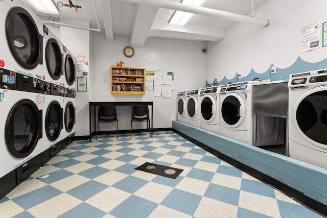 washroom with separate washer and dryer and stacked washing maching and dryer