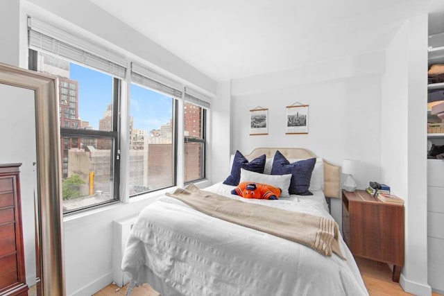 bedroom with light wood-type flooring