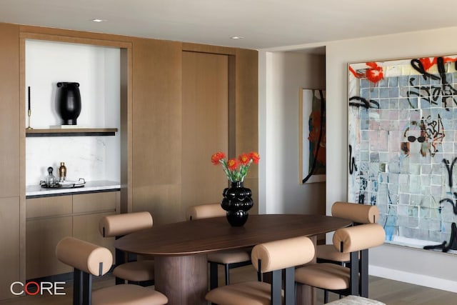 dining area with dark hardwood / wood-style floors