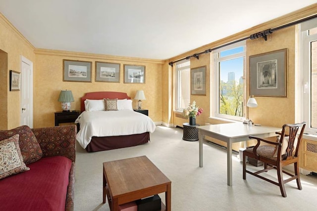 carpeted bedroom featuring ornamental molding