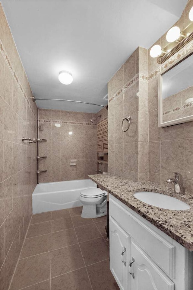 10 Park Ave Unit 5K, New York City, NY 10016 - bathroom with vanity, washtub / shower combination, tile patterned floors, and tile walls