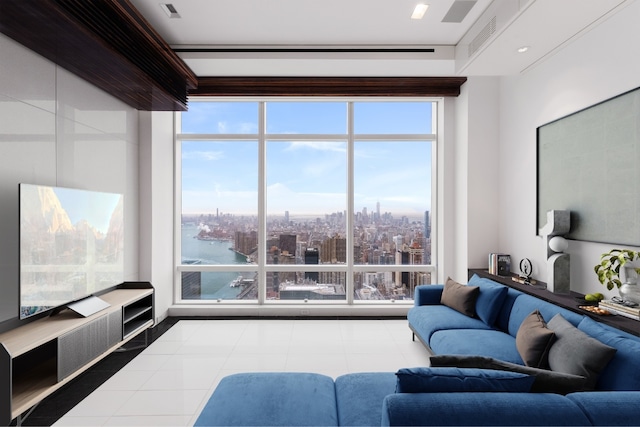 tiled living room featuring a water view