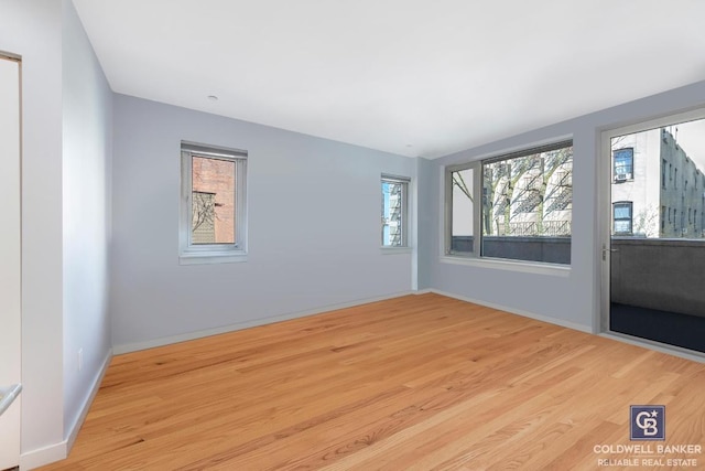 empty room with light wood-type flooring