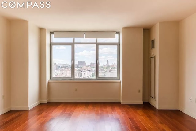 empty room featuring wood-type flooring