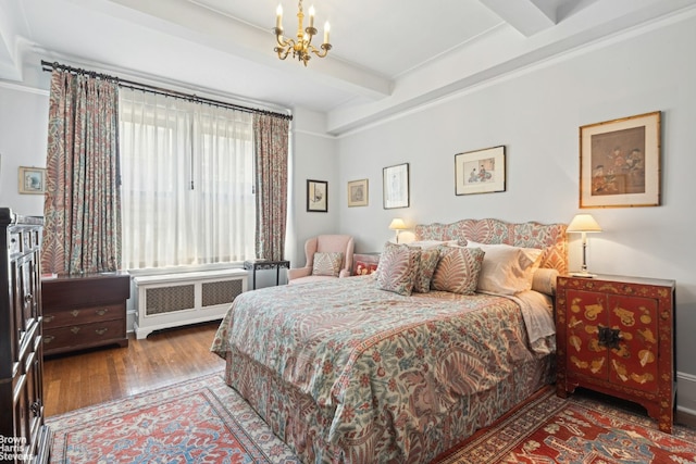 bedroom featuring beamed ceiling, radiator, an inviting chandelier, and hardwood / wood-style flooring