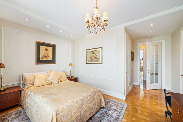 dining room with light parquet flooring, a healthy amount of sunlight, and a chandelier