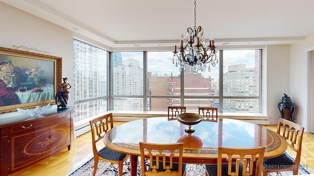 dining area featuring a city view and a notable chandelier