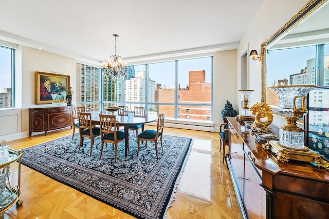 dining space with a notable chandelier, baseboard heating, and a city view