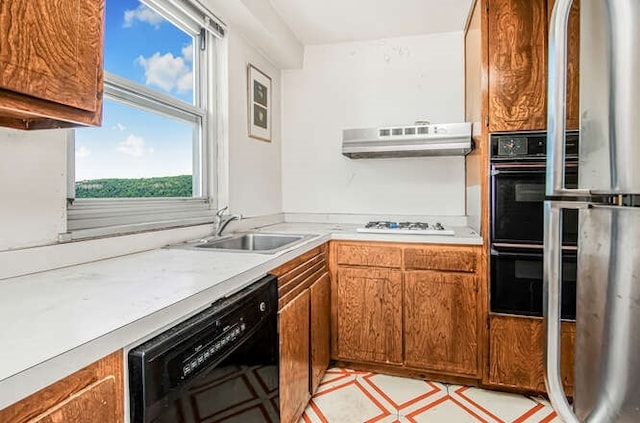 kitchen with sink and black appliances