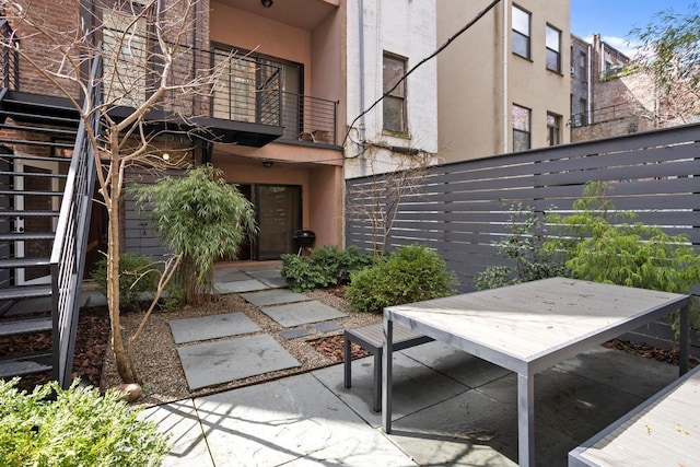 view of patio with a balcony