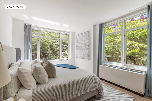 bedroom with radiator and visible vents