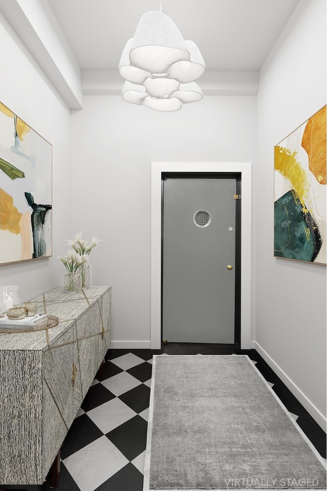 bathroom featuring baseboards and tile patterned floors