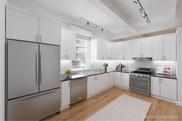 kitchen with white cabinetry, appliances with stainless steel finishes, and light hardwood / wood-style flooring