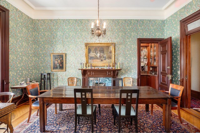 sitting room featuring an inviting chandelier and hardwood / wood-style flooring