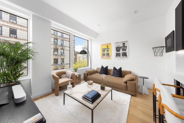 living room with light wood-style floors and baseboards