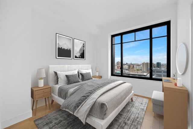 bedroom with hardwood / wood-style flooring