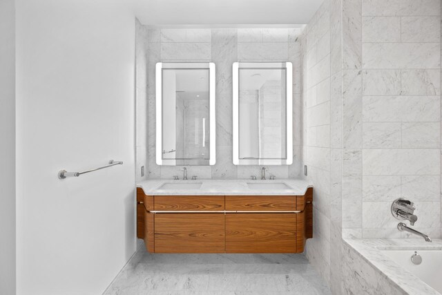 bathroom with vanity and bathtub / shower combination