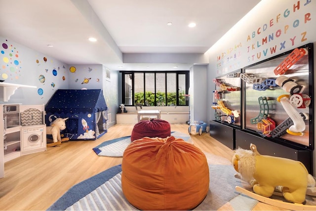 playroom with hardwood / wood-style flooring