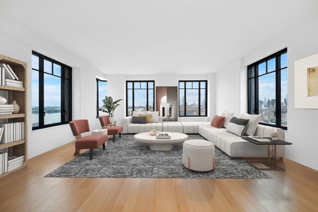 living room with hardwood / wood-style floors and a water view