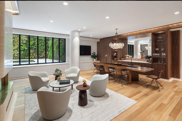 living room featuring light hardwood / wood-style flooring and a notable chandelier