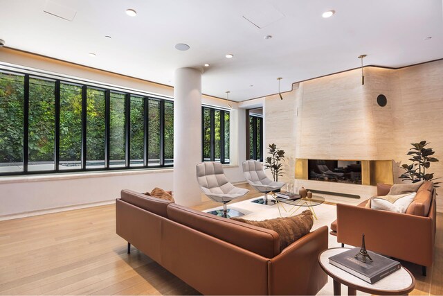 110 Charlton St Unit Ph30C, New York City, NY 10014 - living room featuring wood finished floors, a fireplace, baseboards, and recessed lighting