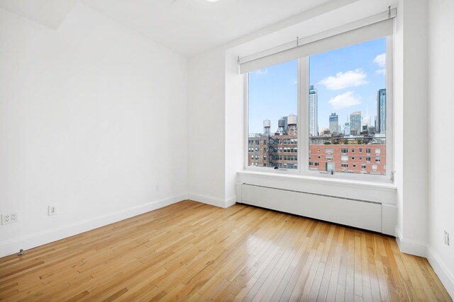 hall with light hardwood / wood-style floors