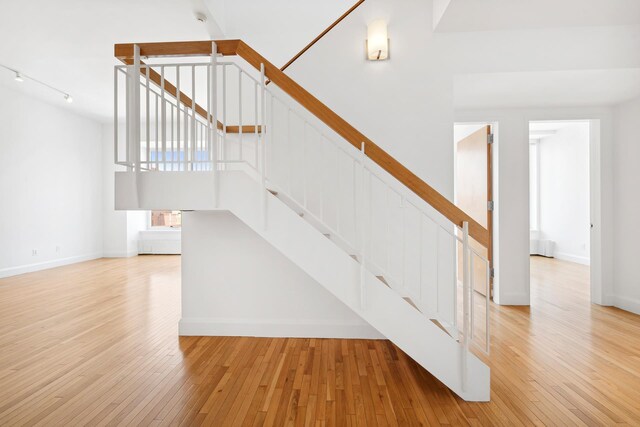 empty room with light hardwood / wood-style floors