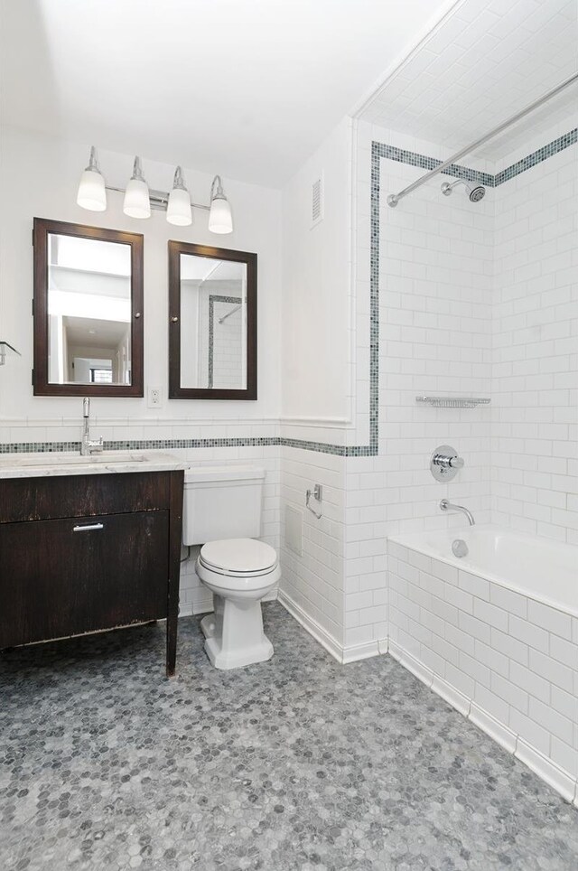 kitchen featuring white cabinetry, sink, white appliances, and decorative backsplash