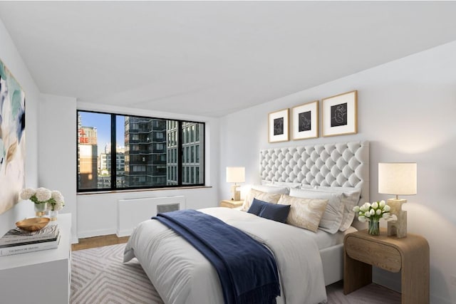 bedroom with light hardwood / wood-style flooring