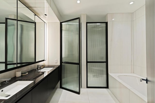 bathroom with vanity, tile patterned floors, and separate shower and tub