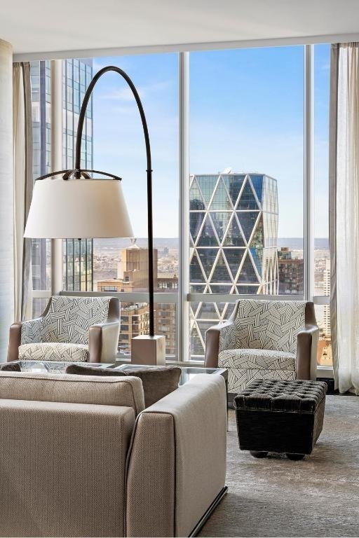 living room featuring a wall of windows