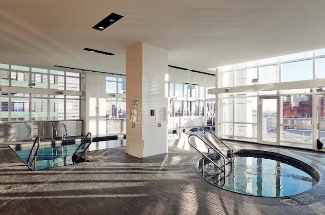 community pool with an indoor hot tub