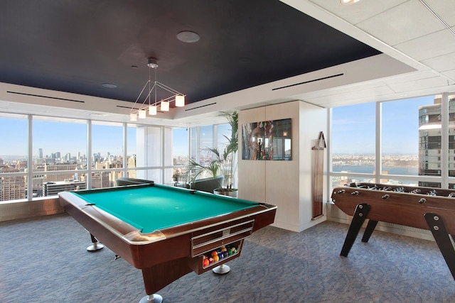 playroom featuring a wealth of natural light, billiards, a city view, and carpet flooring