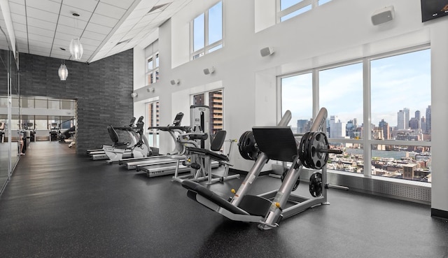 exercise room featuring visible vents and a city view