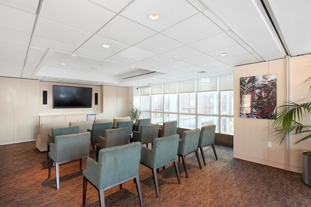 interior space with carpet floors, visible vents, a raised ceiling, and recessed lighting