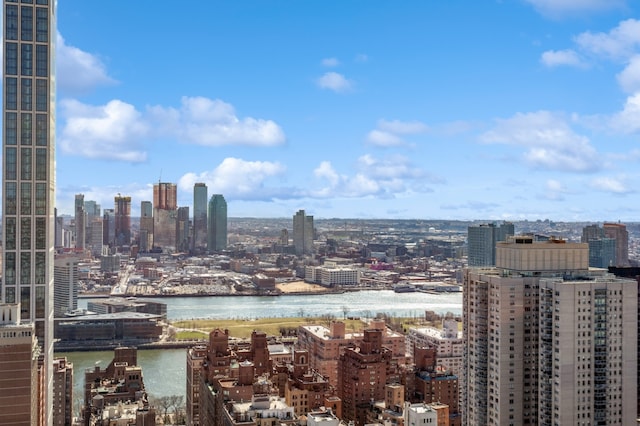 property's view of city featuring a water view