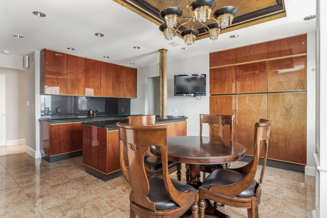 living room featuring a tray ceiling, ornamental molding, and hardwood / wood-style flooring