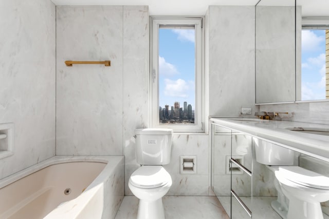 bathroom featuring toilet, a tub to relax in, and a sink