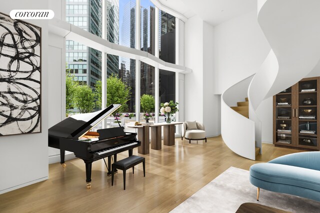 empty room featuring expansive windows and light wood-type flooring