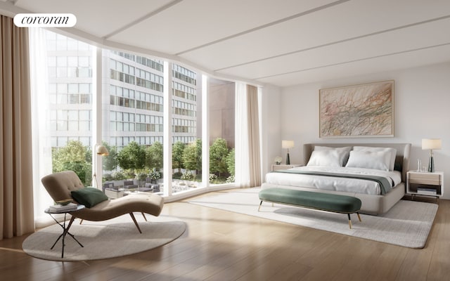 bedroom featuring multiple windows, wood-type flooring, and expansive windows