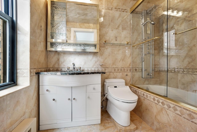 177 E 77th St Unit 5A, New York City, NY 10075 - bathroom with tile walls, tiled shower / bath combo, and vanity