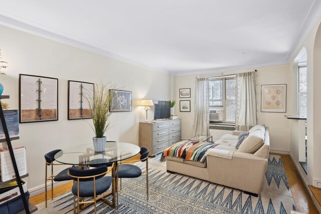 empty room featuring hardwood / wood-style flooring and ornamental molding