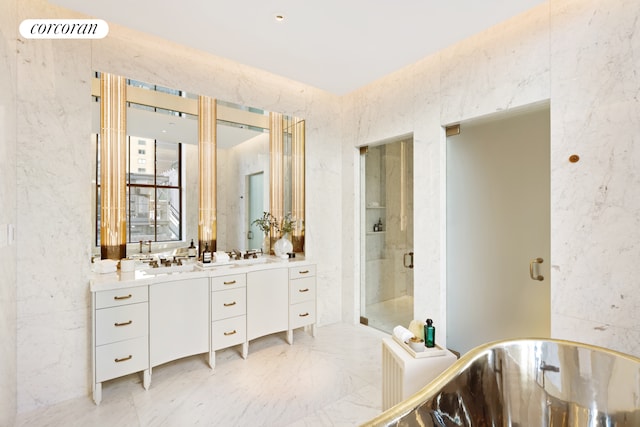 bathroom featuring visible vents, vanity, marble finish floor, a soaking tub, and a stall shower