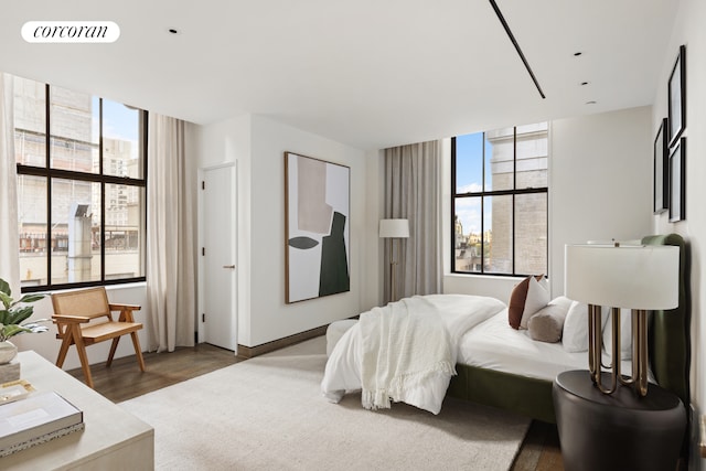 bedroom featuring visible vents and wood finished floors