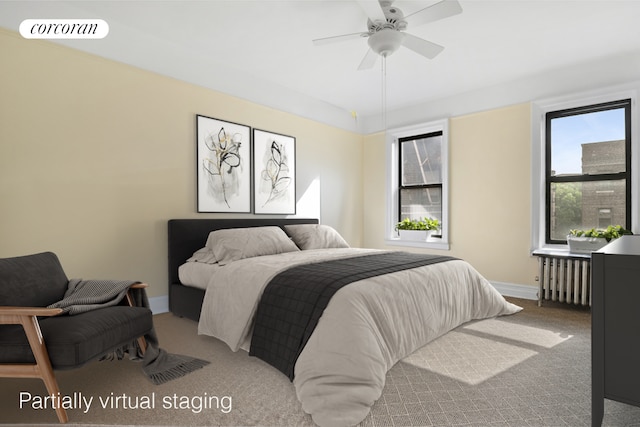 carpeted bedroom with ceiling fan, radiator heating unit, visible vents, and baseboards