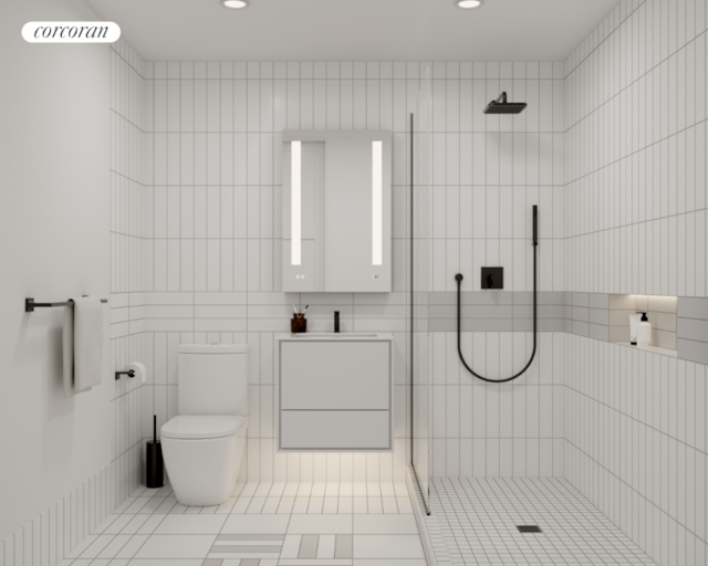 bathroom featuring toilet, vanity, tile patterned floors, and a tile shower