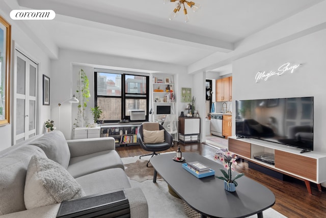 living room with wood finished floors, visible vents, and beam ceiling